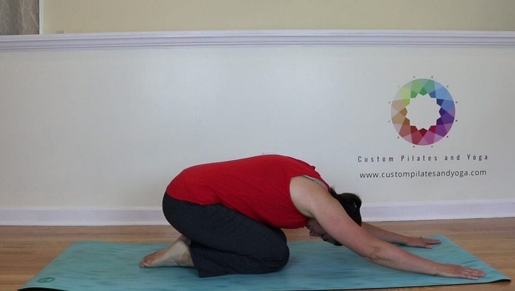 Sarah Stockett doing pilates shell stretch
